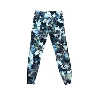 Athleta Green, blue, & black floral leggings with 3/4 inch side‎ mesh detail.
